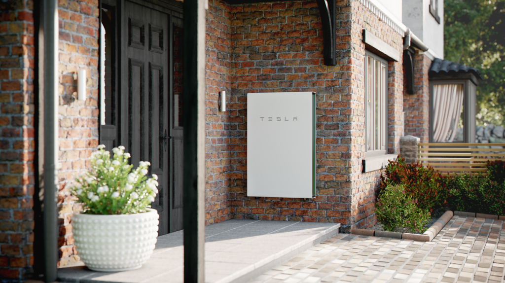 Tesla Battery on brick wall