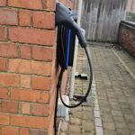 Hypervolt Black on wall