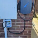 Hypervolt Black on wall