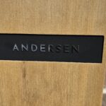 Andersen Logo close up on wooden front charger