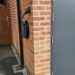 Hypervolt Black on wall