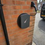Hypervolt Black on wall