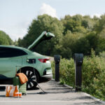 Zaptec_pro_t2s_system_charging_2155 Zaptec ev charger on a black post charging a green car