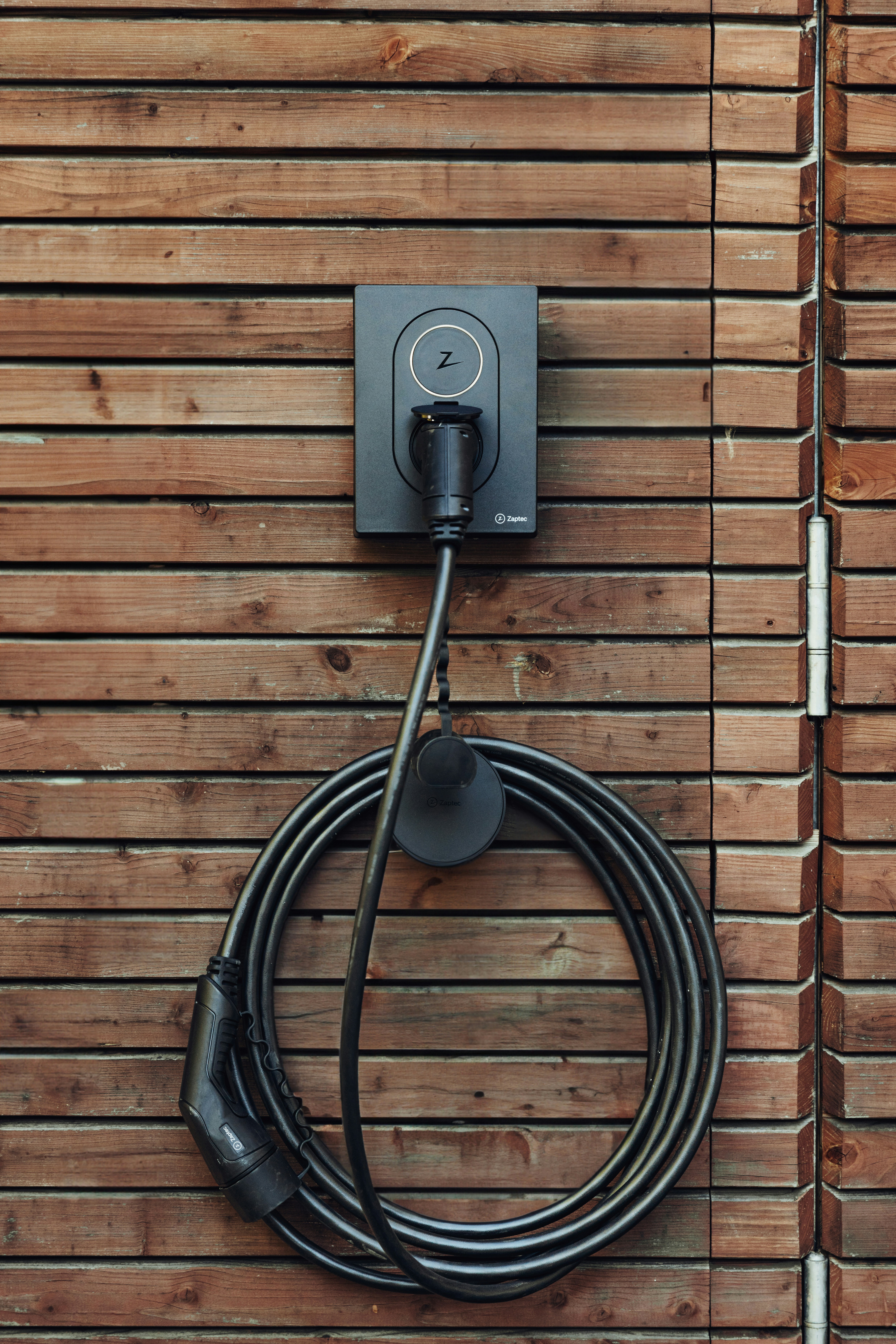 Zaptec EV Charger on a wooden wall