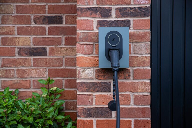 Zaptec qcrk2flsvyi unsplash Zaptec Charger on a brick wall