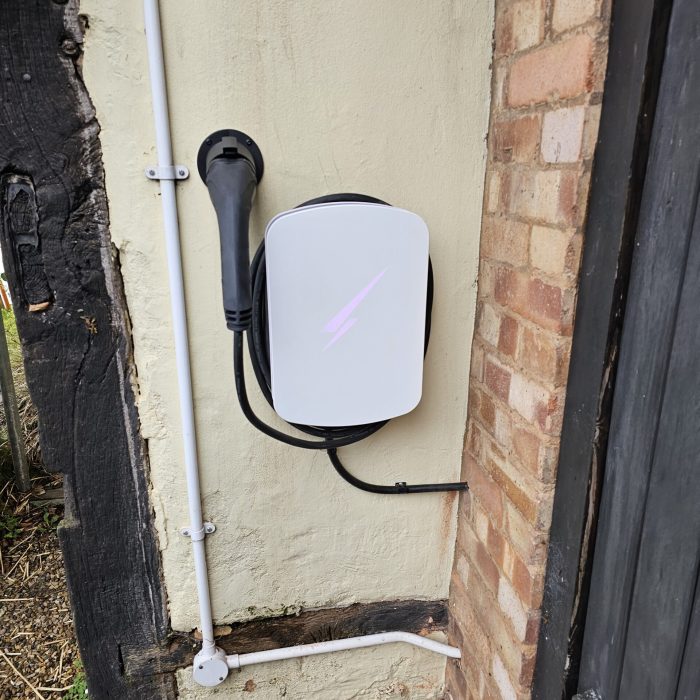 White Hypervolt fixed on cottage wall