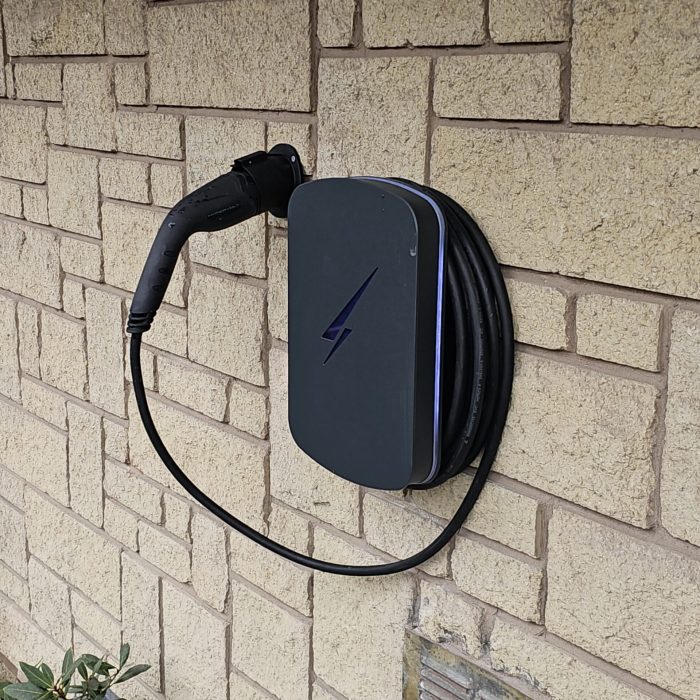 electric car charger fixed to a wall