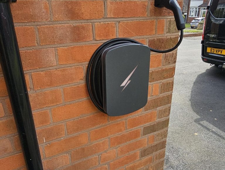 Hypervolt Black on wall