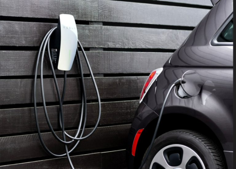 Tesla EV Charger on Black Wood