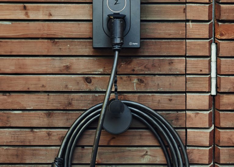 Zaptec EV Charger on a wooden wall