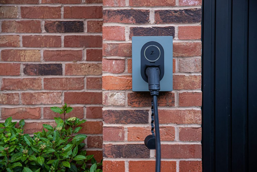 Zaptec Charger on a brick wall